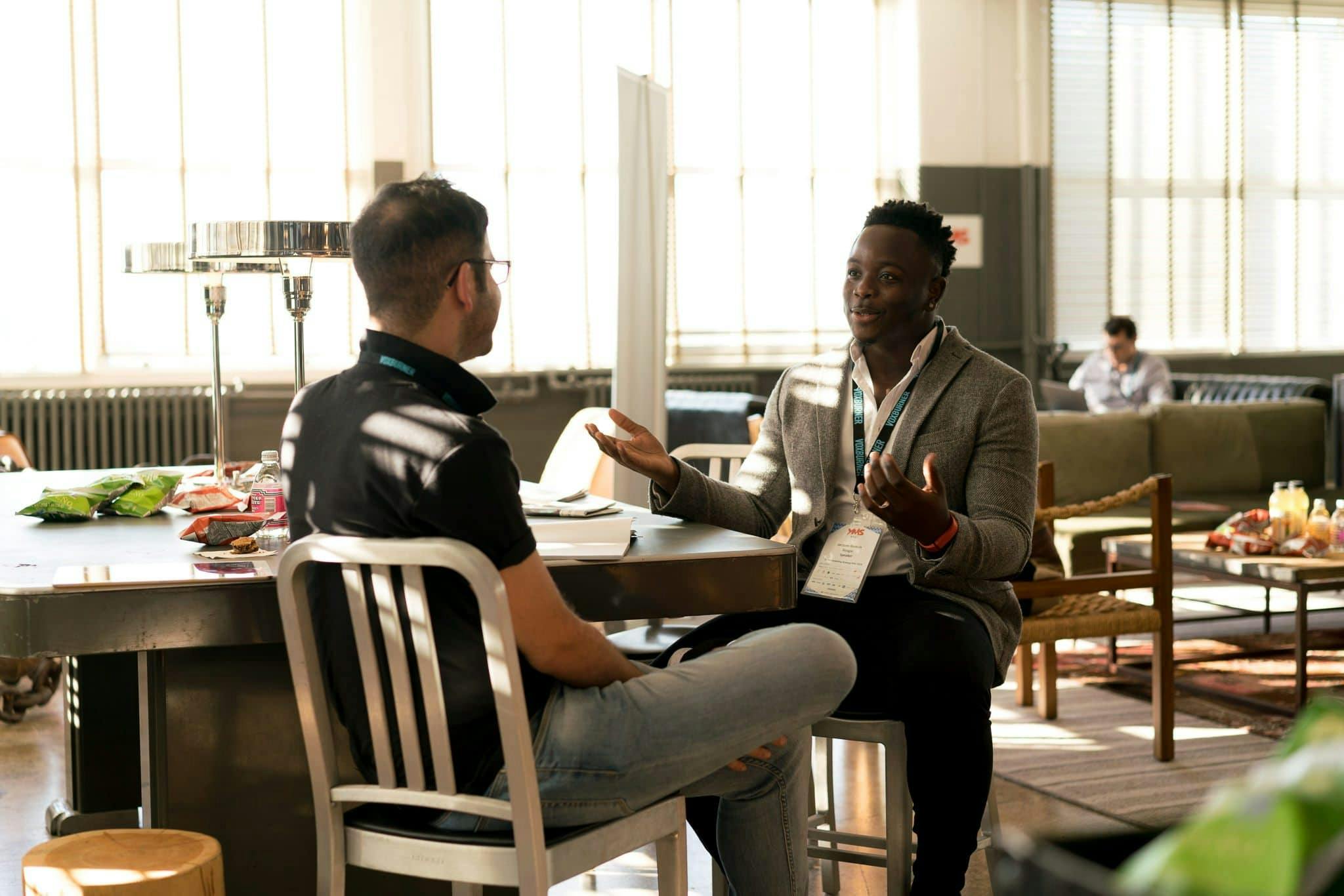Two medical professionals engaged in mentorship discussion, representing personalized guidance and training